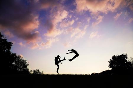 2 People Doing Karate during Sunset