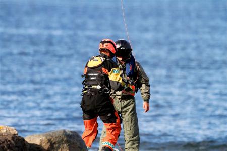 2 Person Wearing Jumpsuit Near Body of Water