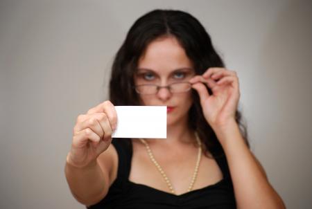 A beautiful woman holding a blank card