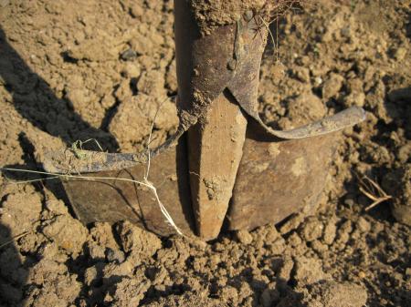 A shovel in the soil