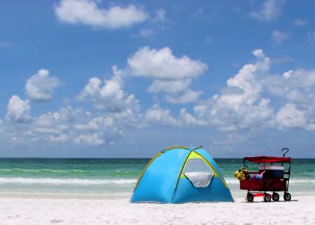 A tent and buggy on a beach
