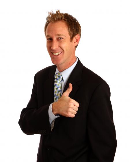 A young businessman giving a thumbs up