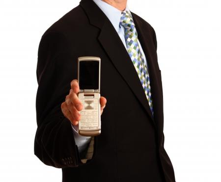 A young businessman holding a cell phone