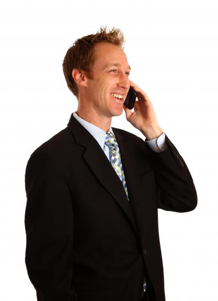 A young businessman talking on a cell ph