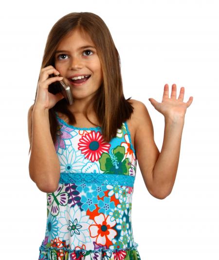 A young girl talking on a cell phone