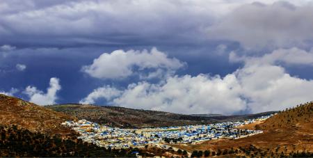 Aerial Photo of Mountain and City