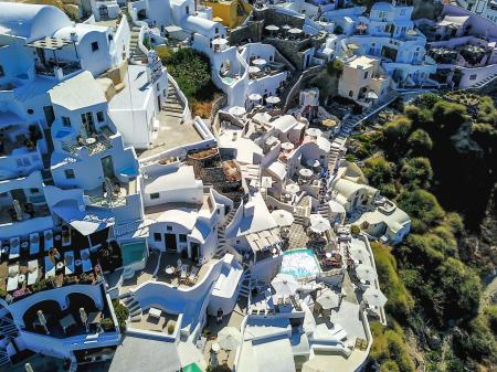 Aerial Photo of White Buildings Near Trees at Daytime