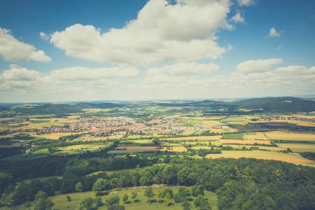 Aerial Photography of Green Fields Under Blue Sky and White Clouds during Daytime