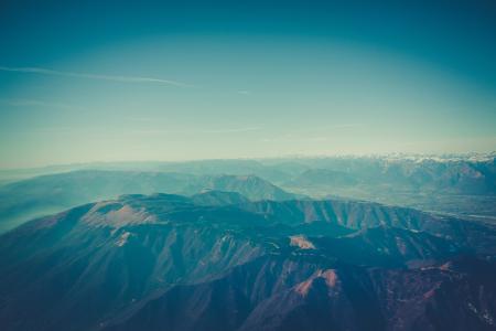 Aerial Photography of Mountain Under Sunny Blue Sky