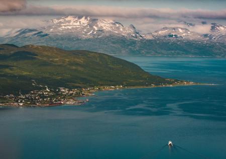 Aerial View Photography of Snow Covered Mountain Beside Ocean