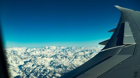 Airplane over mountains