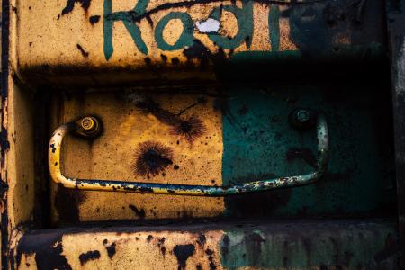 An old rusty metal detail painted in bright colors