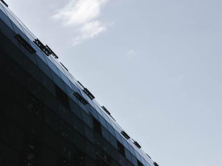 Architectural Photo of Curtain Wall Building Under Blue Sky With White Clouds