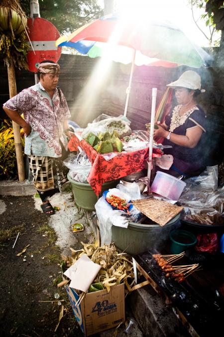 Asian woman selling food on the street