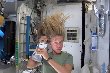 Astronaut Washing Hair