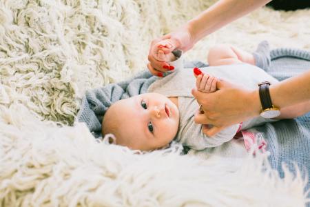 Baby in Gray Long-sleeved Onesie Lying on Beige Fur Textile