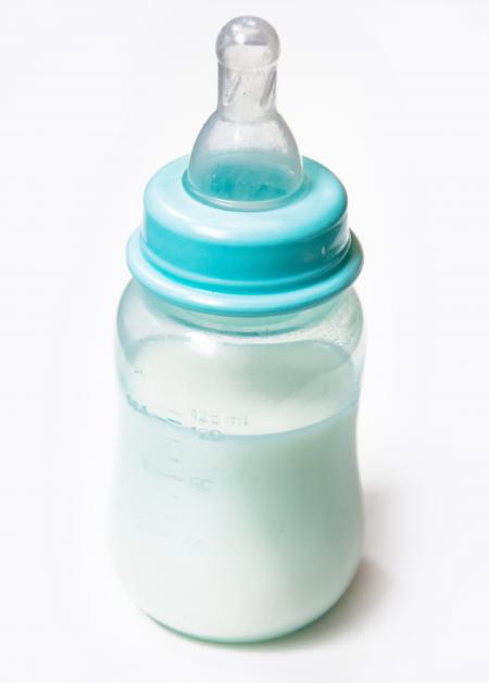 Baby milk bottle isolated on white