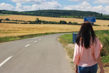 Back View of Woman on Road Against Sky