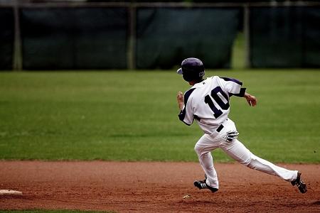 Baseball Player Running on Court