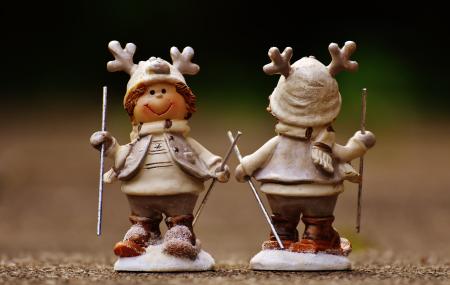 Beige and Brown Boy Skiing Figurine