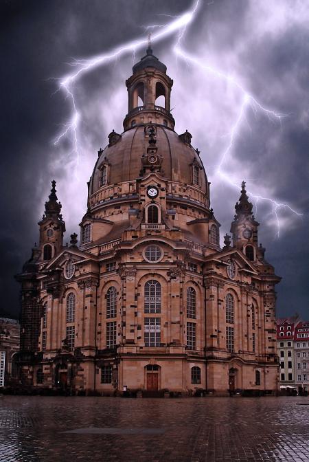 Beige Concrete Building Under Gray Clouds and Lighting