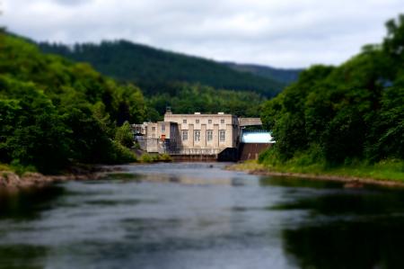 Beige House in on a Forest With River in Front