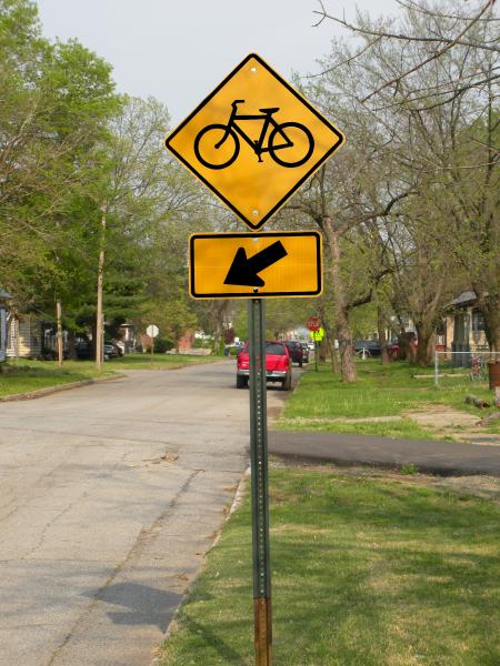 Bicycle sign along street