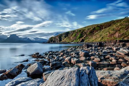 Big Rocks Near Ocean Under Blue Sky