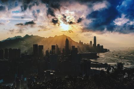 Bird's Eye View of City Near Ocean During Sunset