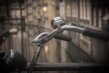 Black and Gray Bicycle Handle Bar With Bell Near Canal