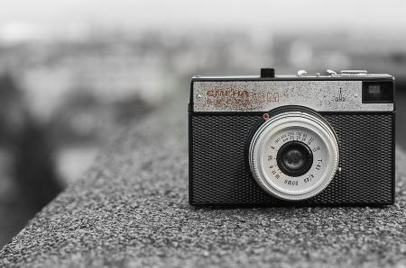 Black and Gray Classic Camera on Gray Concrete