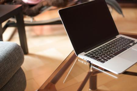 Black and Gray Laptop Computer on Glass Surface