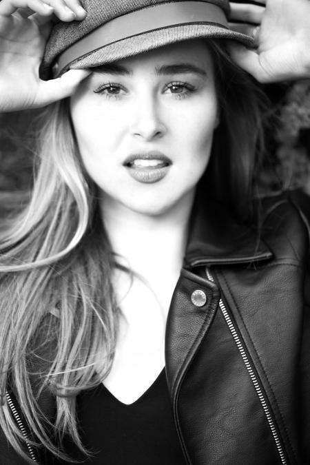 Black and White Photo of a Woman Wearing Leather Jacket