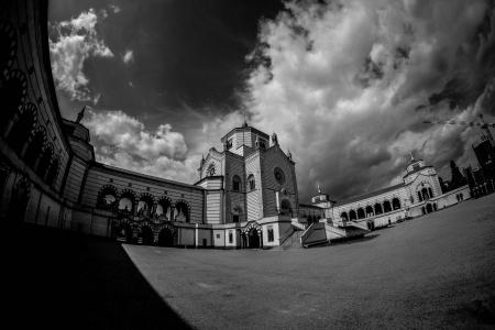Black and White Photo of Cemetery Under White Cloudy Sky