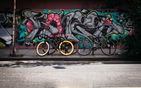 Black and Yellow Fatbike Beside Mountain Bikes