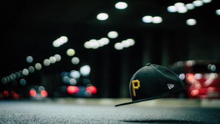 Black and Yellow P Cap Hanging in the Air