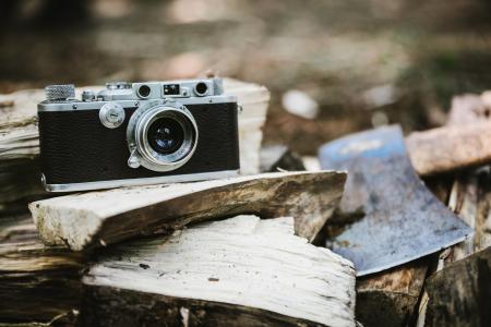 Black Bridge Camera on Wood Burner Beside Pickaxe