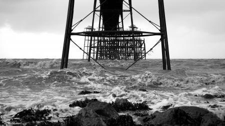 Black Building Structure in the Middle of Body of Water