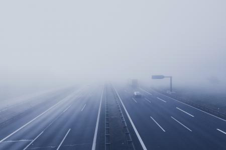 Black Car on Hi-way With Fog