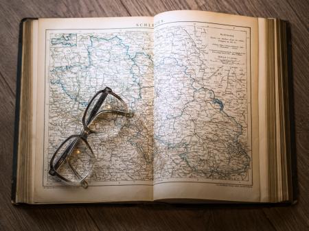 Black Framed Eyeglasses Map in Book