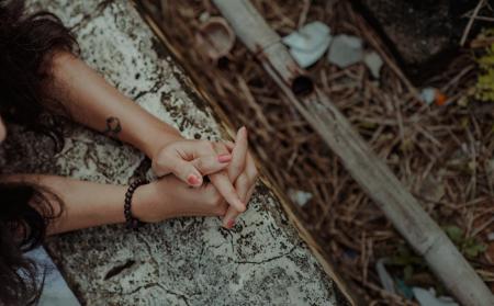 Black Haired Woman Wearing Black Beaded Bracelet