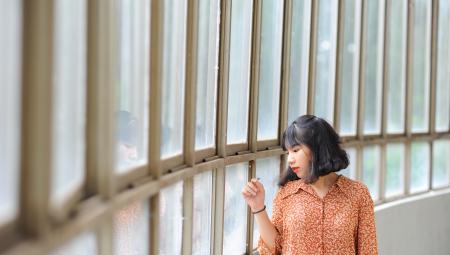 Black Haired Woman Wearing Brown and Yellow Dress Shirt