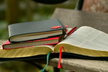 Black Hardbound Book on the Top of the Book