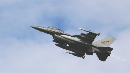 Black Jet Plane Flying Under Blue and White Sky during Daytime