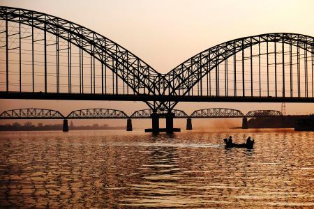 Black Metal Bridge Near on Body of Water