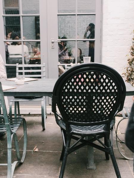 Black Metal Chair Beside Table at Daytime