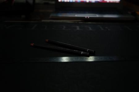 Black Pencil Near Grey Steel Ruler