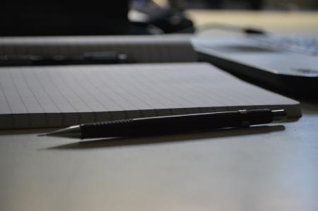 Black Point Pen Beside Ruled Paper