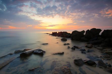 Black Rock Formation on the Sea during Sunset