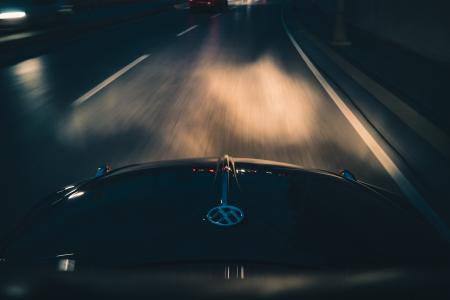 Black Volkswagen Car on Gray Asphalt Road